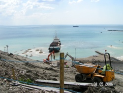 Beach replenishment using shingle from the Isle of Wight and sand from France - all brought by barge